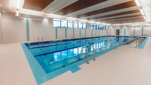 Indoor pool facility ideal for aquafit classes, featuring lanes and modern amenities.