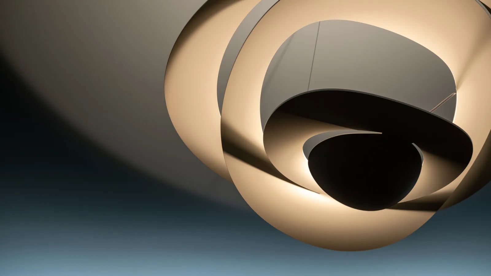 Modern abstract light fixture at MOVATI gym with intertwined curves, representing the fluidity in barre vs pilates workouts.