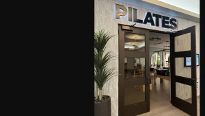 Core Pilates studio entrance with modern decor and equipment visible inside.